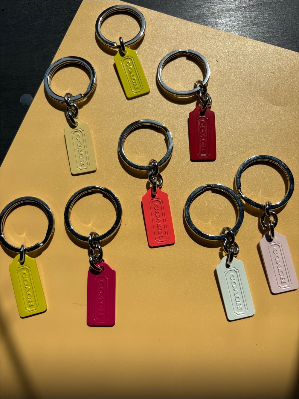 Coach 8 Piece Bundle Metal Tag Keyrings in Yellow, Lime, Red, Pink, Cream, White